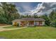 Charming single-story home features a well-manicured lawn and inviting covered front porch at 527 Malcom Rd, Covington, GA 30014
