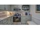 Modern kitchen featuring stainless steel appliances and light-colored countertops at 527 Malcom Rd, Covington, GA 30014