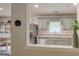 View of the kitchen with stainless steel appliances and muted green cabinets at 527 Malcom Rd, Covington, GA 30014