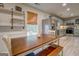 Charming eat-in kitchen with stainless steel appliances, butcher block countertop, and updated cabinets at 527 Malcom Rd, Covington, GA 30014