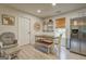 Eat-in kitchen with modern appliances, a rustic bench table set, and plenty of natural light at 527 Malcom Rd, Covington, GA 30014