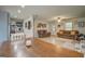 Open-concept living area with a cozy dining table adjacent to a bright living room at 527 Malcom Rd, Covington, GA 30014