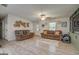 Cozy living room with comfortable seating, decorative wall hangings, and ample natural light at 527 Malcom Rd, Covington, GA 30014