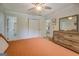 Cozy main bedroom featuring a spacious closet and dresser, filled with natural light at 527 Malcom Rd, Covington, GA 30014