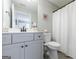 Bathroom featuring a vanity with gray cabinets and a shower with a curtain at 3018 Patriots Square, Marietta, GA 30064