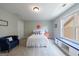 Bright bedroom with a window seat, blue accents, and cozy decorations at 3018 Patriots Square, Marietta, GA 30064