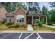 Charming home with stone accents, covered porch, and landscaped front yard at 3018 Patriots Square, Marietta, GA 30064