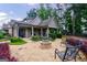 Outdoor fire pit area with stone benches and manicured landscaping at 3018 Patriots Square, Marietta, GA 30064