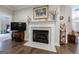 Elegant fireplace with marble surround, decorative mantle, and hardwood flooring at 3018 Patriots Square, Marietta, GA 30064