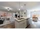 Spacious kitchen island with granite countertops, stainless steel sink, and pendant lighting at 3018 Patriots Square, Marietta, GA 30064