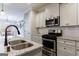 Kitchen features stainless steel appliances, granite countertops, white cabinetry, and eat-in area at 3018 Patriots Square, Marietta, GA 30064