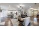 Bright open-concept living area with hardwood floors, fireplace, and ample seating at 3018 Patriots Square, Marietta, GA 30064