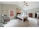 Spacious main bedroom features tray ceilings, carpeted floors and ensuite bath at 3018 Patriots Square, Marietta, GA 30064