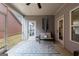 Covered patio with a bench and rug for outdoor living at 3018 Patriots Square, Marietta, GA 30064