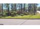 Welcome to Peachcrest Trace, beautiful landscaping enhances the community entrance at 1611 Cobbs Creek Ln, Decatur, GA 30032