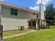 A spacious backyard with a covered patio, offering an ideal outdoor living space for relaxation and entertainment at 4489 Northwind Dr, Ellenwood, GA 30294