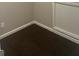 Corner in basement with brown carpet, white trim and painted walls at 4489 Northwind Dr, Ellenwood, GA 30294