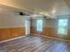 Finished basement features white trim, flooring and two windows at 4489 Northwind Dr, Ellenwood, GA 30294