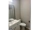 Bathroom features white vanity with square sink, a silver faucet and a framed mirror at 4489 Northwind Dr, Ellenwood, GA 30294