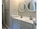 A bathroom features double sinks and modern fixtures, perfect for getting ready in the morning at 4489 Northwind Dr, Ellenwood, GA 30294