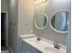 A stylish bathroom features double sinks, modern fixtures, and ample counter space at 4489 Northwind Dr, Ellenwood, GA 30294