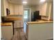 Well-lit kitchen featuring white cabinets, butcher block countertops, and modern appliances, great for cooking at 4489 Northwind Dr, Ellenwood, GA 30294