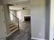 Spacious living room featuring a fireplace and modern gray flooring at 4489 Northwind Dr, Ellenwood, GA 30294