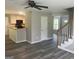 Open concept living area features a kitchen and stairway at 4489 Northwind Dr, Ellenwood, GA 30294