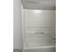 Full shower shows white shower walls with handle and tub at 4489 Northwind Dr, Ellenwood, GA 30294