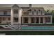 Rear exterior view of a modern farmhouse with a swimming pool at 120 Godby Dr, Fayetteville, GA 30215