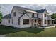 An inviting farmhouse-style house with a relaxing outdoor seating area at 120 Godby Dr, Fayetteville, GA 30215