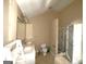 Bathroom featuring a double vanity, toilet, and shower with glass door at 2841 Heritage Ln, Morrow, GA 30260
