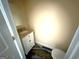 Small powder room featuring patterned floors, a marble sink, and an elongated toilet at 2841 Heritage Ln, Morrow, GA 30260