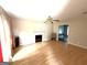 Bright living room features hardwood floors, a fireplace, and a ceiling fan at 2841 Heritage Ln, Morrow, GA 30260