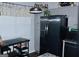 Bright kitchen with stainless steel refrigerator, pendant lighting, and ample cabinet space at 3253 Blackfoot Ln, Rex, GA 30273