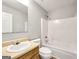 Well-lit bathroom features a single sink vanity and a shower-tub combination at 2039 Faith Cv, Atlanta, GA 30349