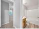 This bathroom features a vanity with wood cabinet and a shower-tub combination at 2039 Faith Cv, Atlanta, GA 30349