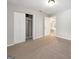 This bedroom features neutral carpeting, a double door closet, and ample natural light at 2039 Faith Cv, Atlanta, GA 30349