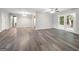 Light-filled living area featuring gray flooring, a ceiling fan, and patio access through French doors at 2039 Faith Cv, Atlanta, GA 30349