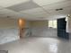 Unfinished basement featuring decorative marble-style wainscoting, drop ceiling and tile floors offers potential for customization at 5793 Springfield Pl, Ellenwood, GA 30294