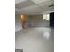 Unfinished basement featuring decorative marble-style wainscoting, drop ceiling and tile floors offers potential for customization at 5793 Springfield Pl, Ellenwood, GA 30294