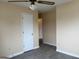 This bedroom offers natural light and modern, gray wood-look flooring at 5793 Springfield Pl, Ellenwood, GA 30294