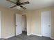 This bedroom features modern, gray wood-look flooring at 5793 Springfield Pl, Ellenwood, GA 30294