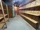 Spacious basement storage room with plywood shelving at 370 Rosetta Nw Ln, Conyers, GA 30012