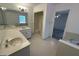 Bathroom featuring a tub and shower combo and a long vanity at 370 Rosetta Nw Ln, Conyers, GA 30012