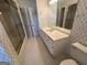Spacious bathroom with a shower, toilet, and a long vanity with storage at 370 Rosetta Nw Ln, Conyers, GA 30012