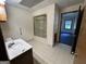Bathroom features tile flooring, sink and shower/tub combo at 370 Rosetta Nw Ln, Conyers, GA 30012