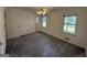 Bright bedroom with neutral carpet and a ceiling fan, with two windows providing great light at 370 Rosetta Nw Ln, Conyers, GA 30012