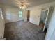 Spacious bedroom with neutral carpet and ceiling fan, bright natural light from multiple windows at 370 Rosetta Nw Ln, Conyers, GA 30012