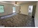 Spacious bedroom with neutral carpet, a ceiling fan, and access to a bathroom and outdoor deck at 370 Rosetta Nw Ln, Conyers, GA 30012